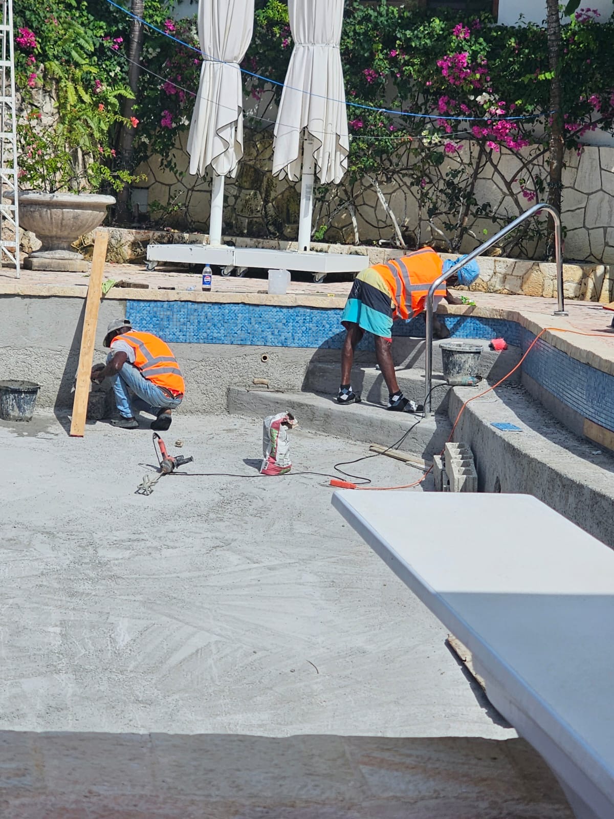 Equip Pro JA crew finishing a luxury poolside renovation in Montego Bay